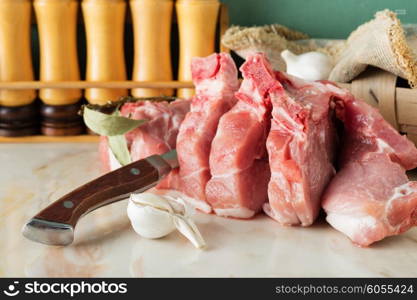 Chopped pork on a marble countertop in the kitchen