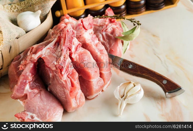 Chopped pork on a marble countertop in the kitchen