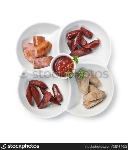 chopped sausages fried with spices isolated on white background