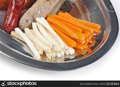 chopped sausages fried with vegetables a isolated on white background