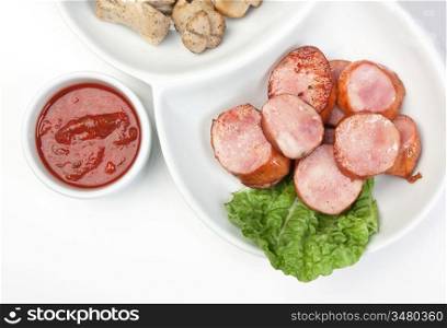 chopped sausages fried with vegetables and spices