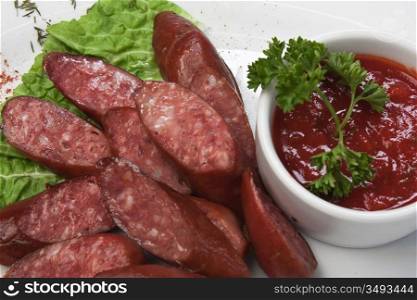chopped sausages fried with vegetables and spices
