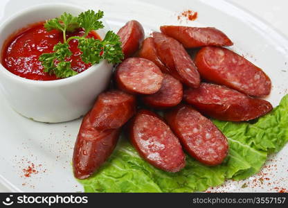 chopped sausages fried with vegetables and spices