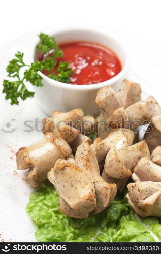 chopped sausages fried with vegetables and spices isolated on white background