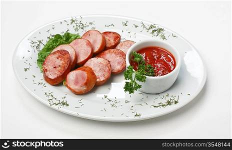 chopped sausages fried with vegetables and spices on white background
