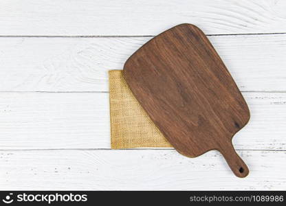 Chopping board natural kitchen tools wood products / Kitchen utensils with wooden cutting board background , top view