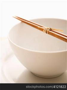 Chopsticks on an Empty Bowl. Isolated
