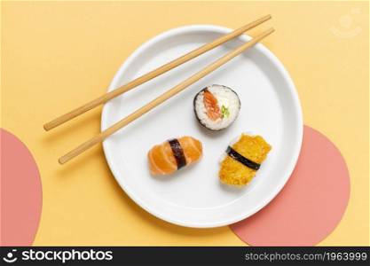 chopsticks plate with sushi. High resolution photo. chopsticks plate with sushi. High quality photo