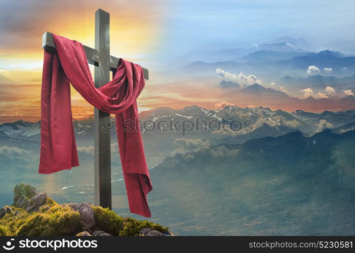 Christian cross against the sky over the mountains