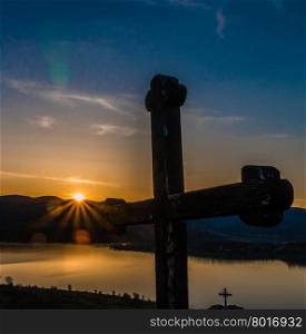 Christian cross against the sunset