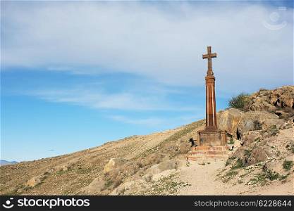 Christian cross near ancient monastery Khor Virap in the mountains of Armenia. Was founded in years 642-1662.