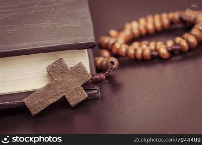 Christian cross necklace on Holy Bible book, Jesus religion concept as good friday or easter festival