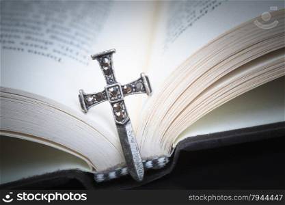 Christian cross necklace on Holy Bible book, Jesus religion concept as good friday or easter festival