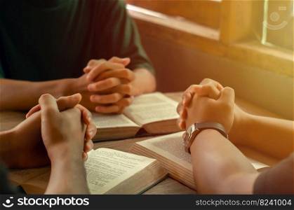 Christians join a group of cells that come together to pray and seek the blessings of God. with bible and share the gospel with copy space near the window sill in the morning