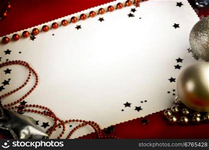 Christmas Advertising Space Decoration with Balls and Stars at the Red Background