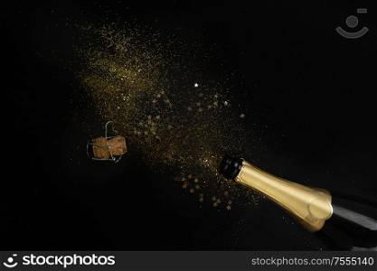 Christmas amd Happy New Year Champagne splash over black background. Christmas amd Happy New Year Champagne