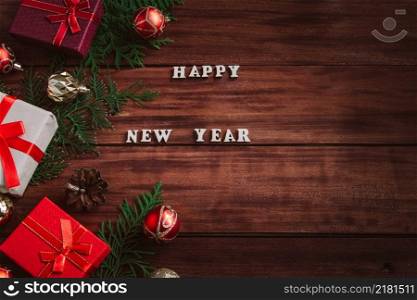 Christmas and new year concept. Gift boxes and decor on a wooden background.. Christmas and new year concept. Gift boxes and decor on wooden background.