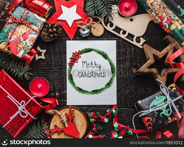 Christmas and New Year decorations lying on the table. View from above, close-up, indoors, no people. Studio photo. Congratulations for family, relatives, friends and colleagues. Christmas and New Year decorations lying on the table