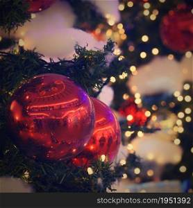 Christmas and New Year holidays background, winter season. Christmas greeting card with ornaments and lights for tree.