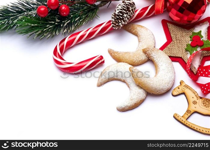 Christmas and New Year symbols and attributes of winter holidays - candy, cookies, pine cone. High quality photo. Christmas and New Year symbols and attributes of winter holidays - candy, cookies, pine cone