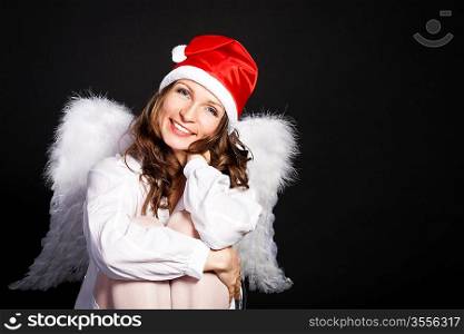 Christmas angel against black background