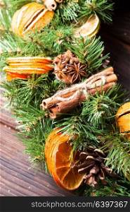 Christmas aromatic eco wreath. Christmas aromatic eco wreath with dry orange and cinnamon sticks, closeup details