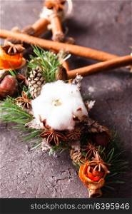 Christmas aromatic star. Christmas aromatic decor, cinnamon sticks tied as five-pointed star with rope, acorns and cotton flower