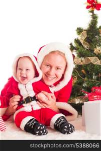 Christmas baby and mom under the fir tree