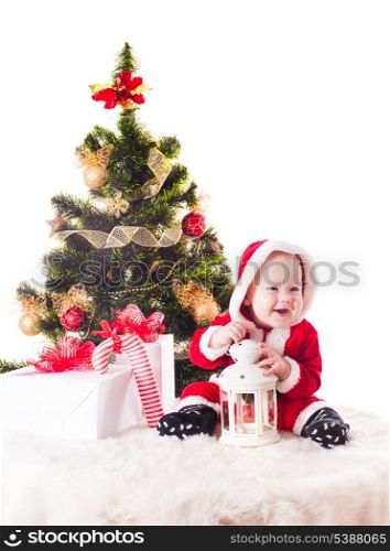 Christmas baby under the New Years tree with gifts