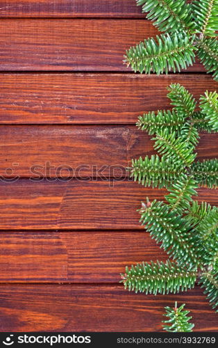 christmas background, christmas tree, branch on the wooden table