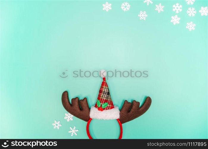 Christmas background concept. Top view of Christmas decoration, Santa Claus and reindeer on green background