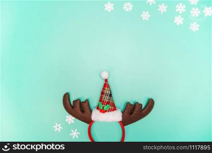 Christmas background concept. Top view of Christmas decoration, Santa Claus and reindeer on green background