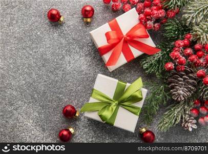Christmas Background. Fir Tree Decorations  And Gift Boxes On Black Concrete With Copy Space. Christmas or New Year festive card