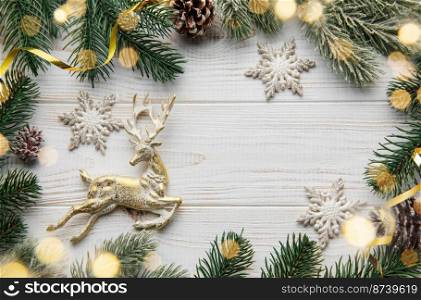 Christmas Background. Fir Tree Decorations  On White Wooden Background  With Copy Space. Christmas or New Year festive card