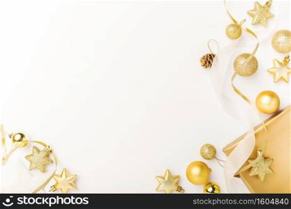 Christmas background. Flat Lay with Christmas golden deco baubles on white. Copy Space. Horizontal. 