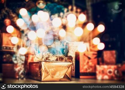 Christmas background , home scene with holiday gifts and festive bokeh lighting