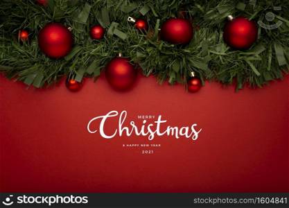 Christmas background made with garlands on a red background