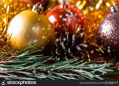 Christmas background of Christmas balls and Christmas tree branches. Spruce branches and Christmas balls. Festive background