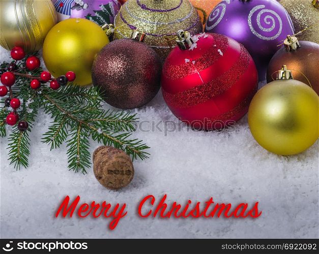 Christmas background of Christmas balls, spruce branches. With congratulatory text