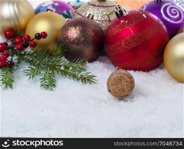 Christmas background of Christmas balls, spruce branches. With congratulatory text