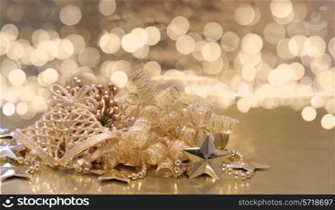 Christmas background of golden decorations on a background of defocussed lights
