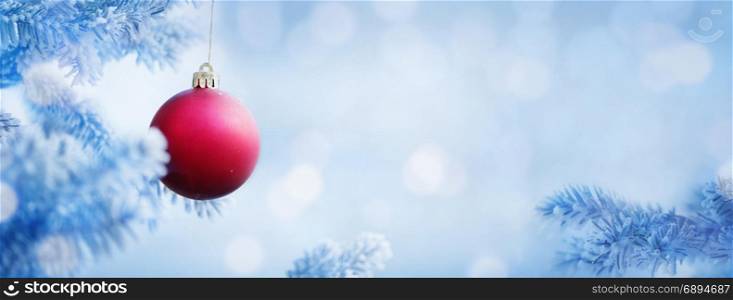 Christmas Background of Red Ball on the Blue Christmas Tree with Snow