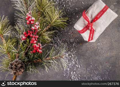 Christmas background, pine cones, red striped canes on background with Fir branches. Xmas and Happy New Year composition. Flat lay, top view.