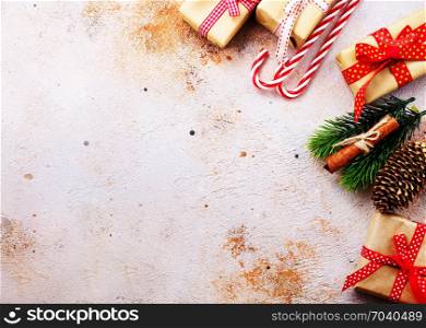 christmas background, presents and candycanes on a table