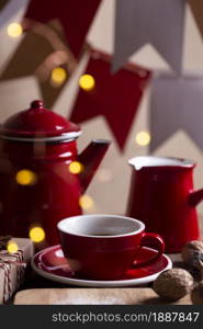 christmas background. red teapot, cup and cezve on the background of flags