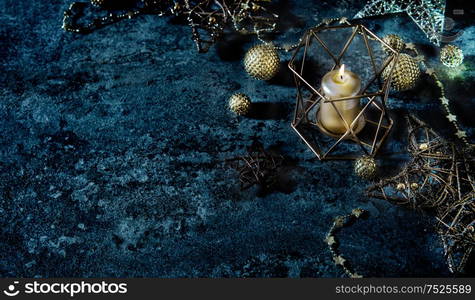 Christmas background stars, balls and candle. Festive lights decoration. Vintage style dark toned photo