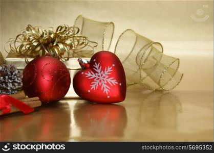 Christmas background with a heart shaped bauble