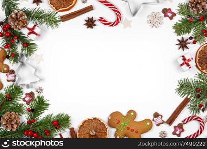Christmas background with balls and decorations of holly berry, cones, gifts, balls, cookies on white. Christmas background with decorations