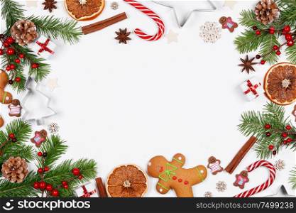 Christmas background with balls and decorations of holly berry, cones, gifts, balls, cookies on white. Christmas background with decorations