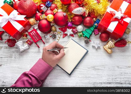 Christmas background with balls and decorations over wooden table